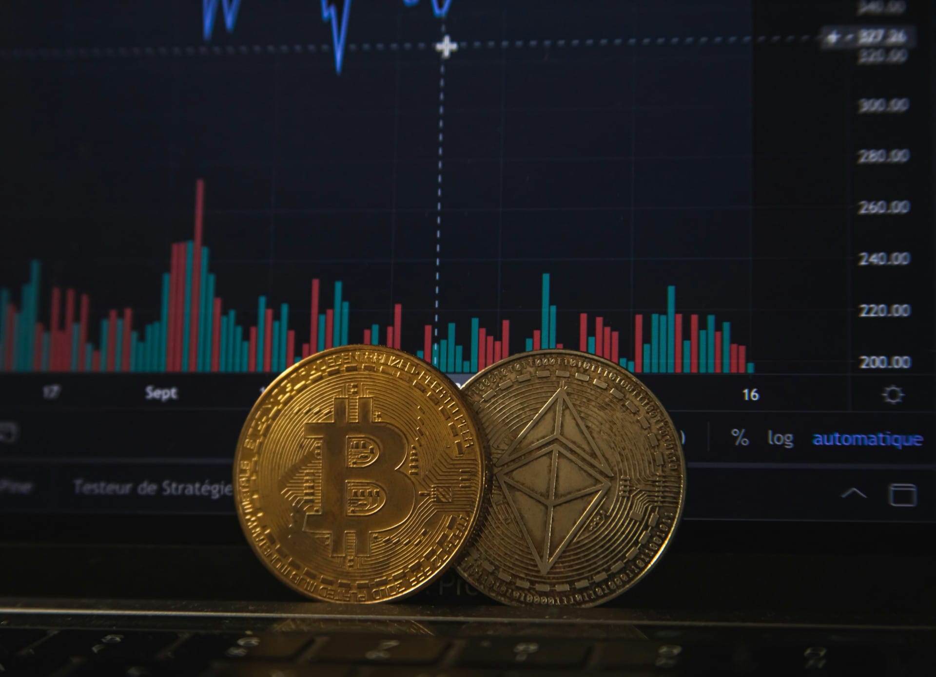 bitcoin and ethereum in front of a crypto graph